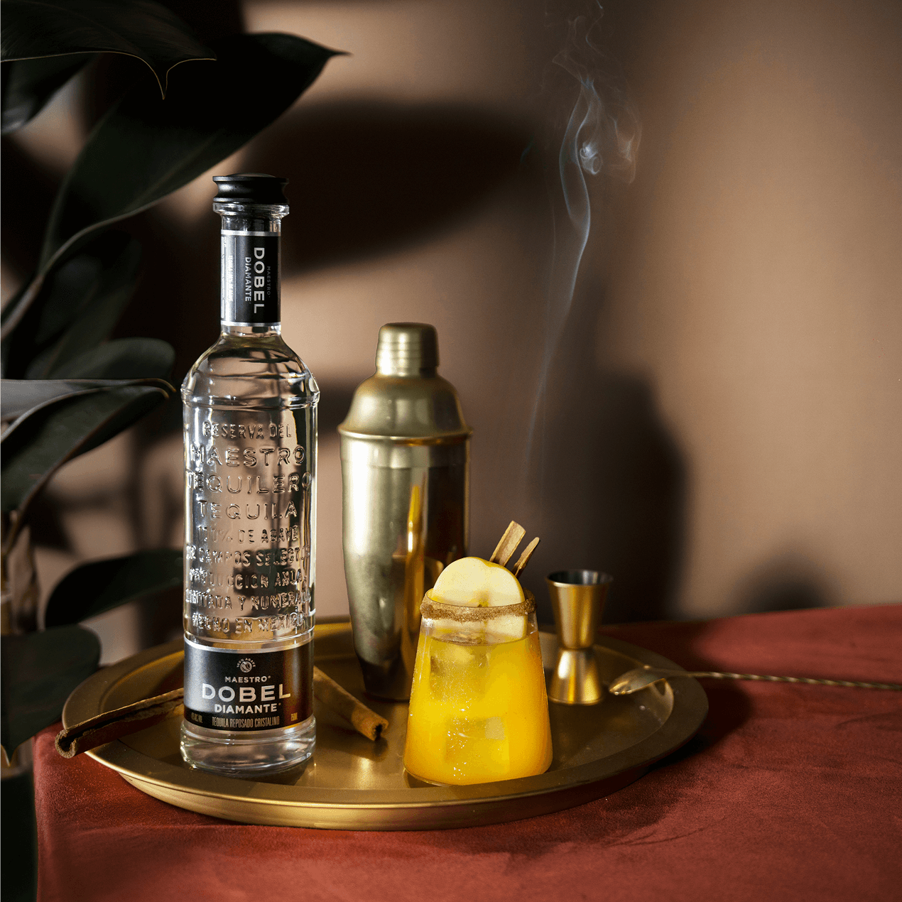 Dobel Diamante Cristalino bottle with smoky apple cocktail