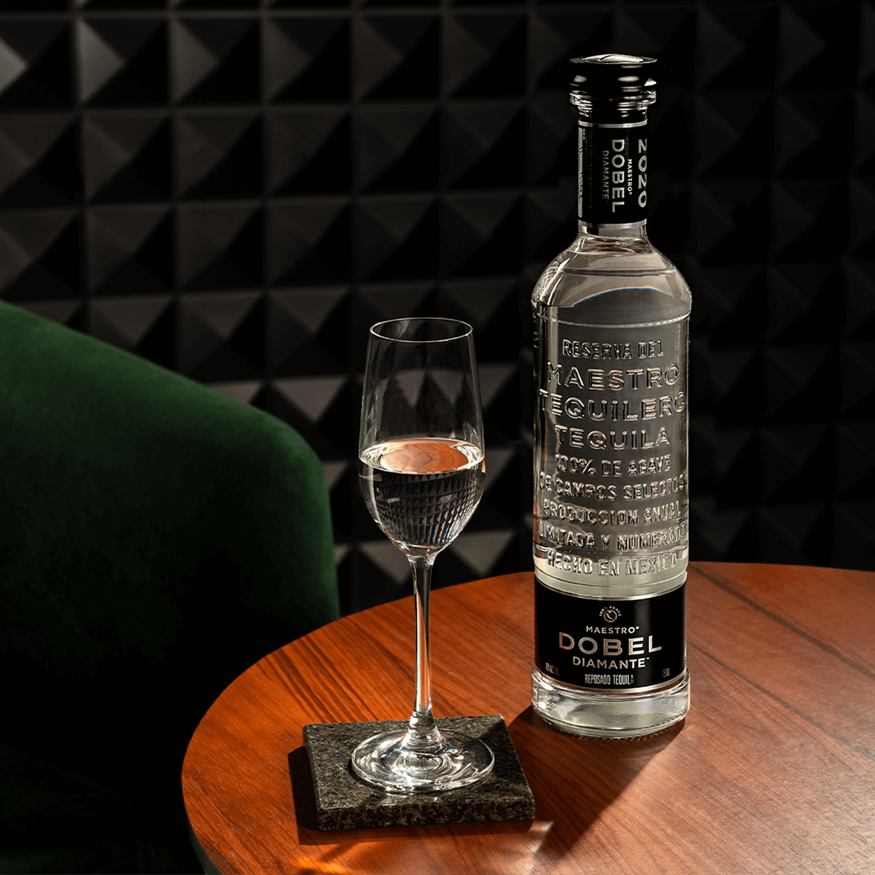 Dobel Diamante Cristalino bottle with neat serve in tequila flute