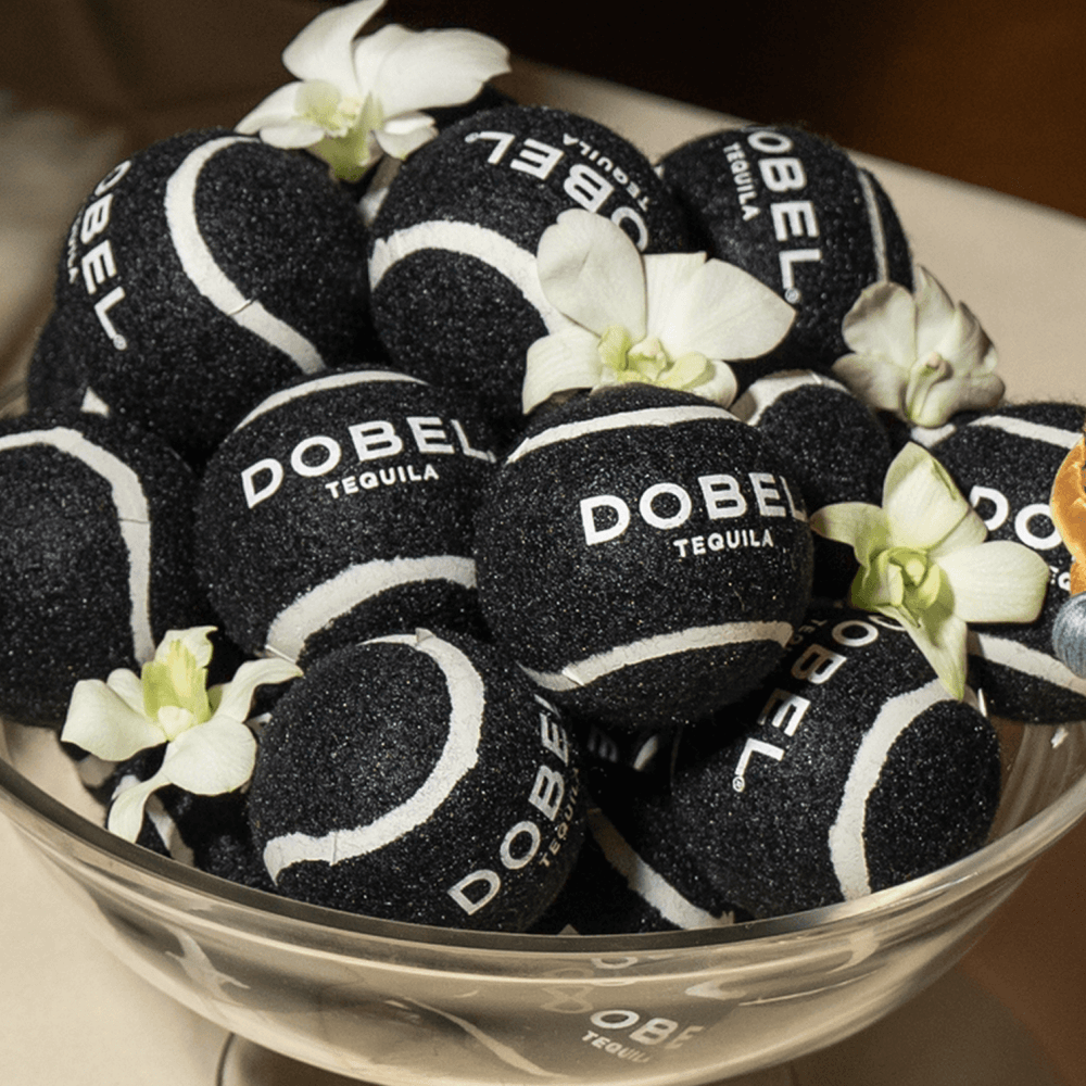 Bowl of black Dobel tennis balls at US Open evnt.