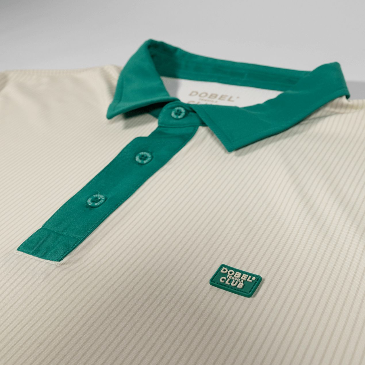 Close up of green trim details on collar and buttons.
