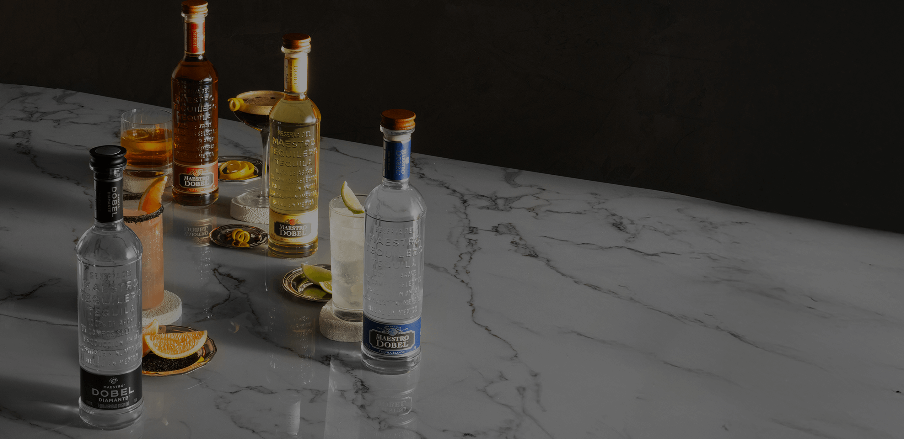 Dobel bottles with their respective signature cocktails