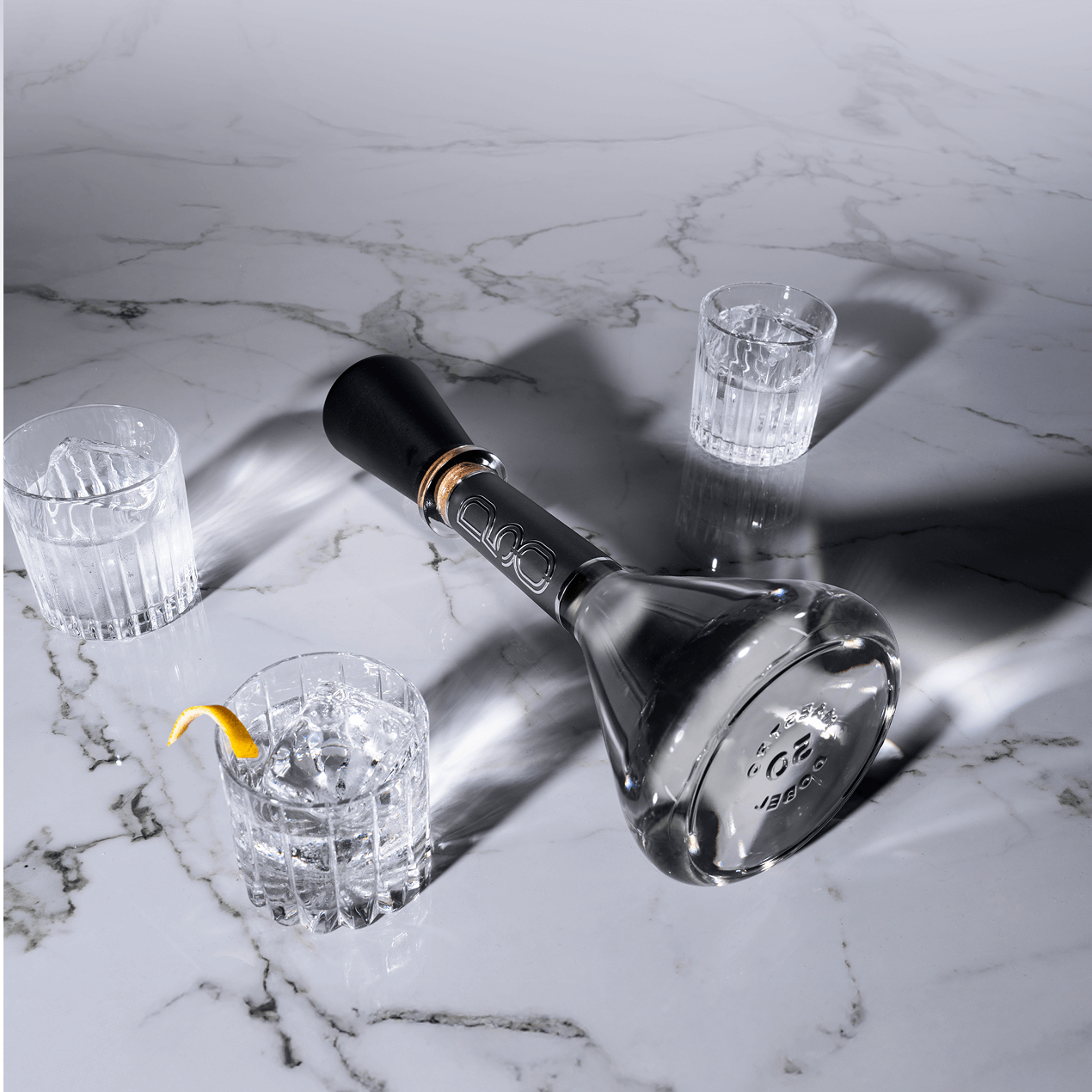 Dobel 50 Cristalino Extra Añejo bottle with black luxury case, premium presentation.