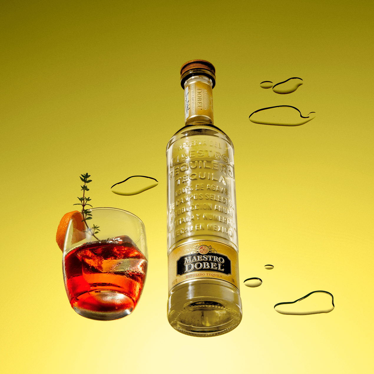 Dobel Reposado bottle with red cocktail and garnish on yellow background