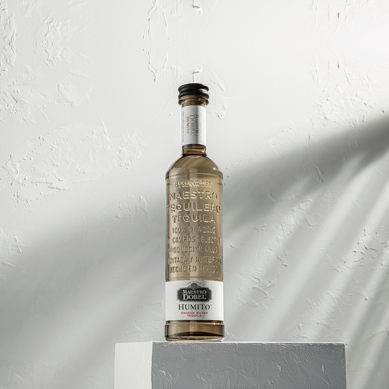 Dobel Humito bottle on pedestal