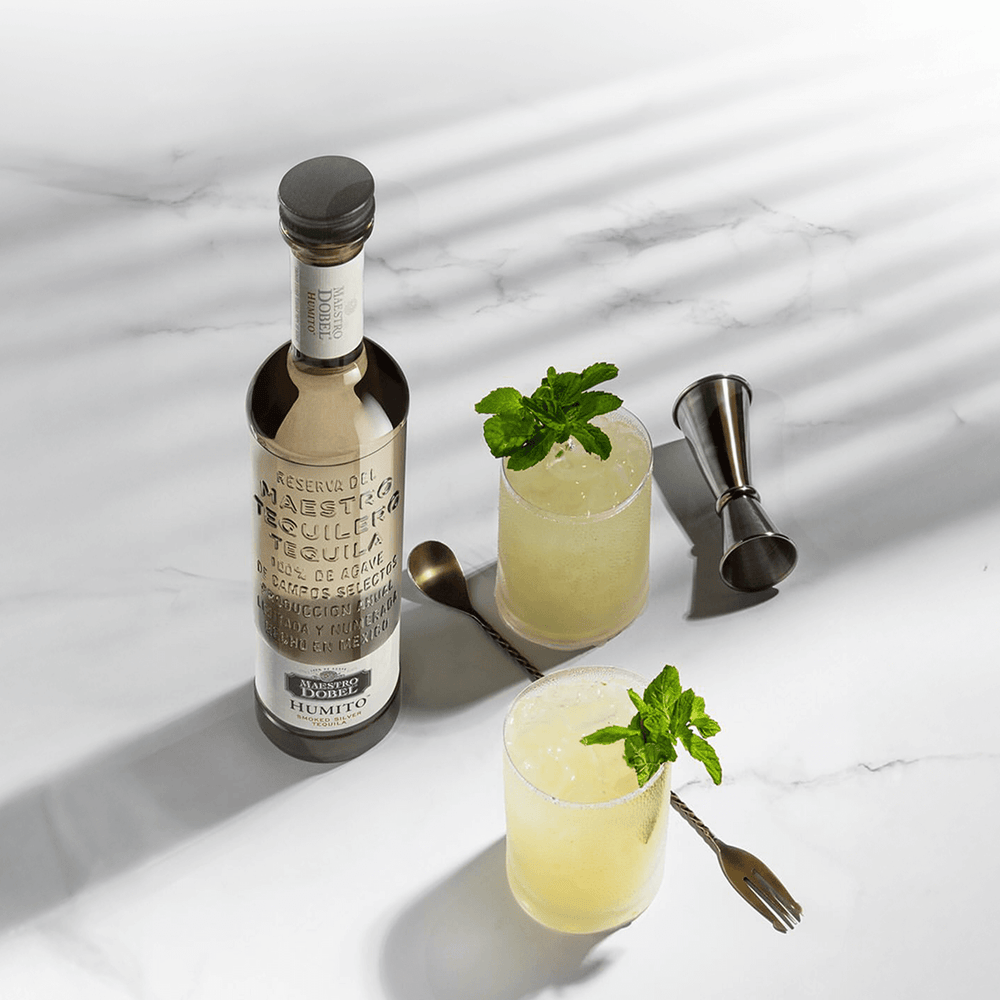 Dobel Humito bottle with two cocktails