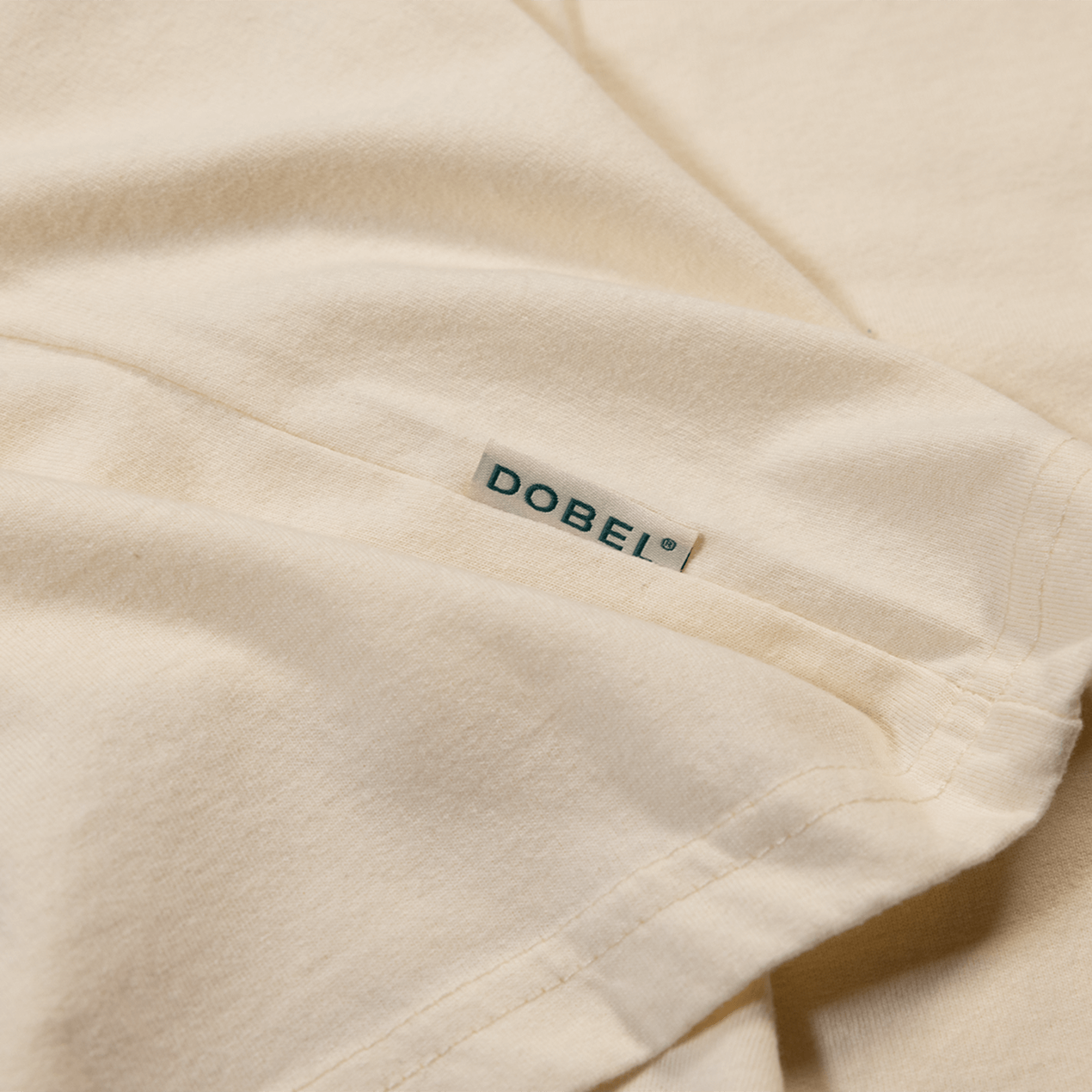 Close up detail of small Dobel tag logo.