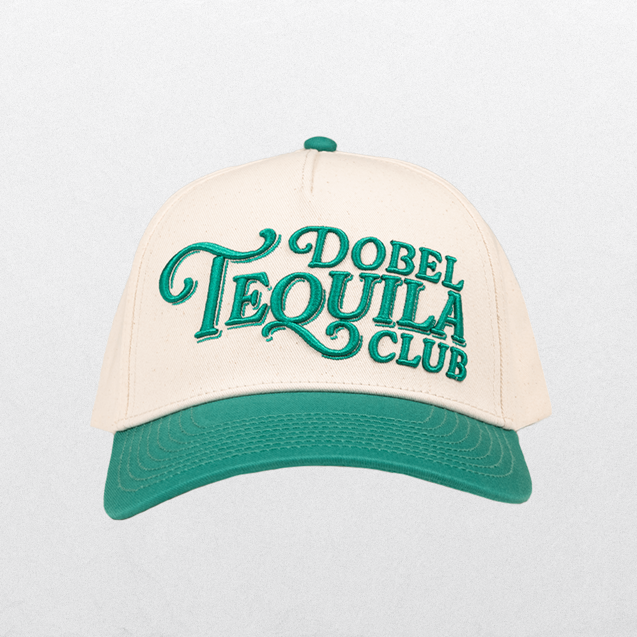 Front of snapback hat with Dobel Tequila Club lettering graphic.
