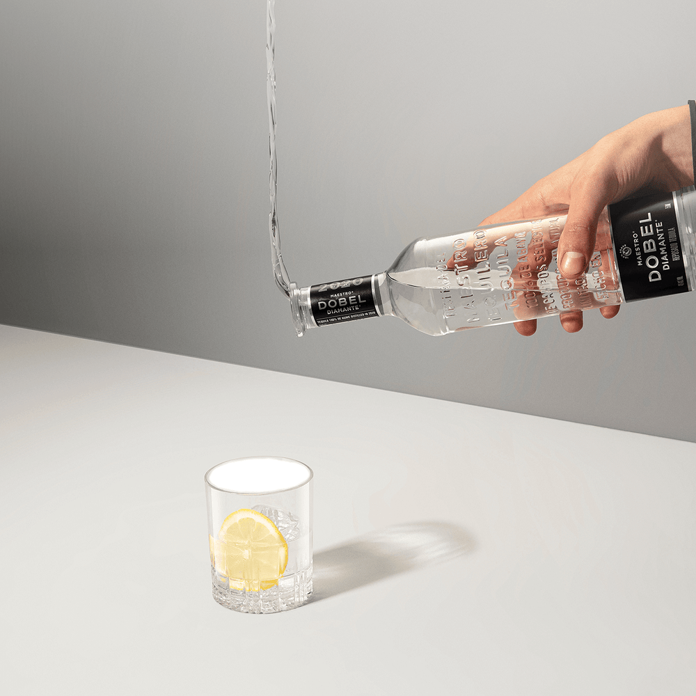 Dobel Diamante Cristalino bottle pouring into signature cocktail