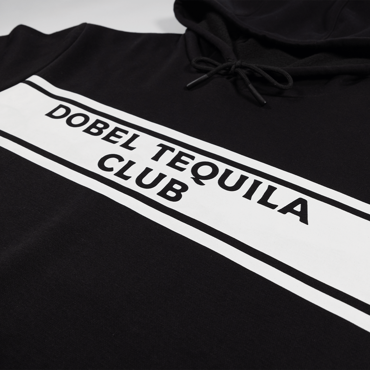 Detail shot of Dobel Tequila Club graphic across chest.