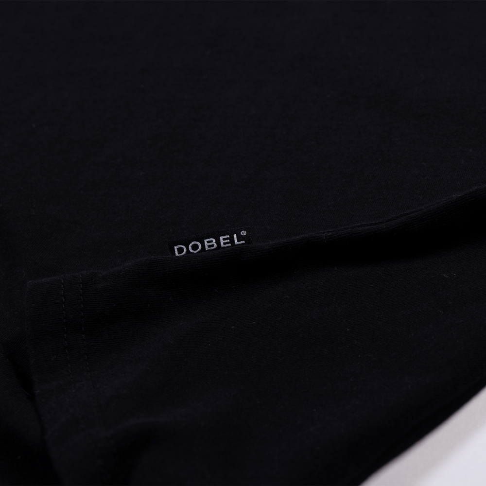 Close up detail of small Dobel tag logo.