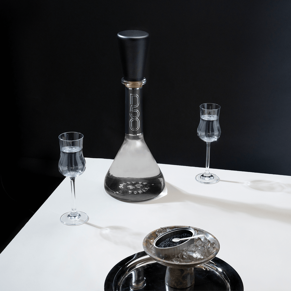 Dobel 50 Cristalino Extra Añejo bottle on dark background, highlighting the crystal shine.
