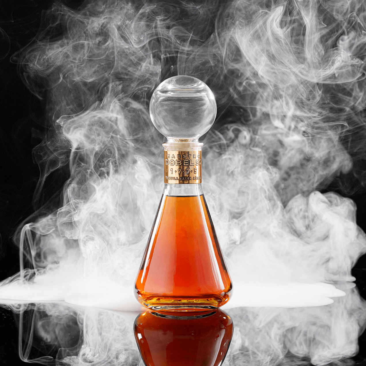 Dobel 50 Extra Añejo 1975 bottle with a white smokey background on black.