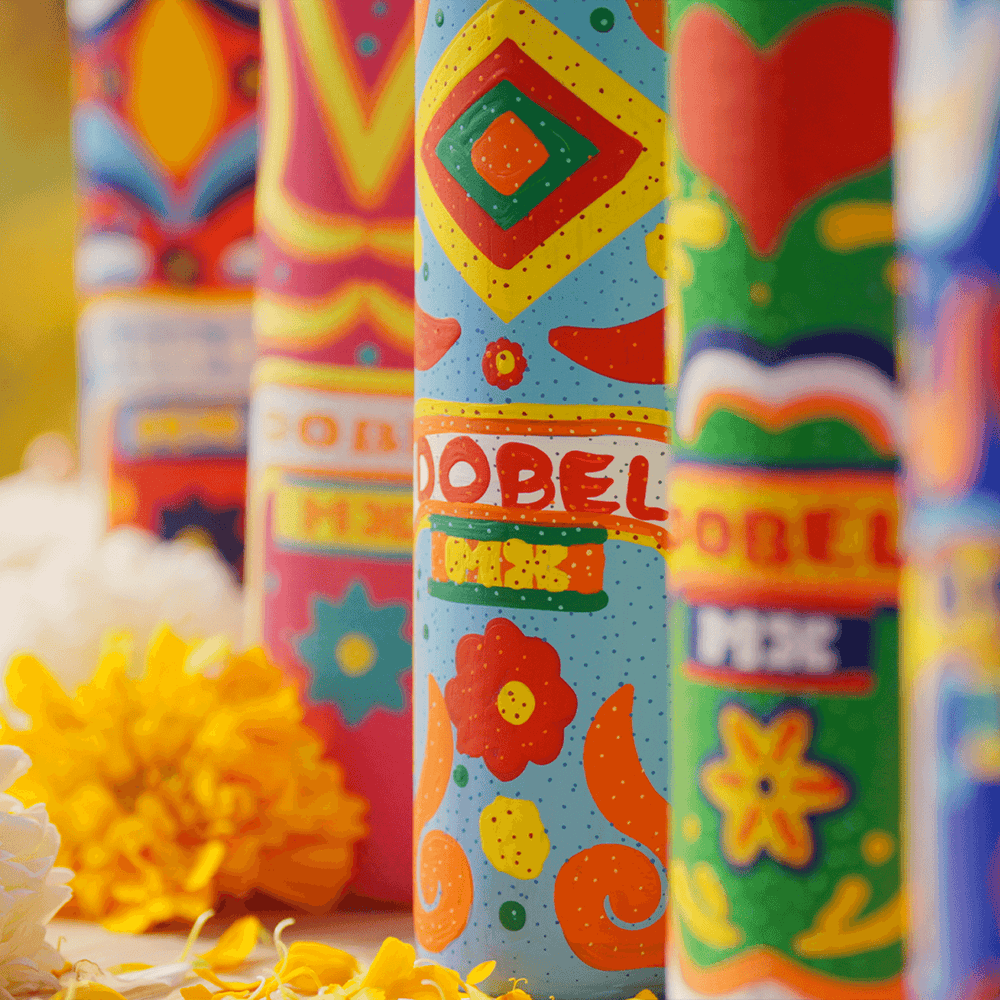 Dobel Atelier: Trajineras Edition close-up of colorful bottle designs with flowers.