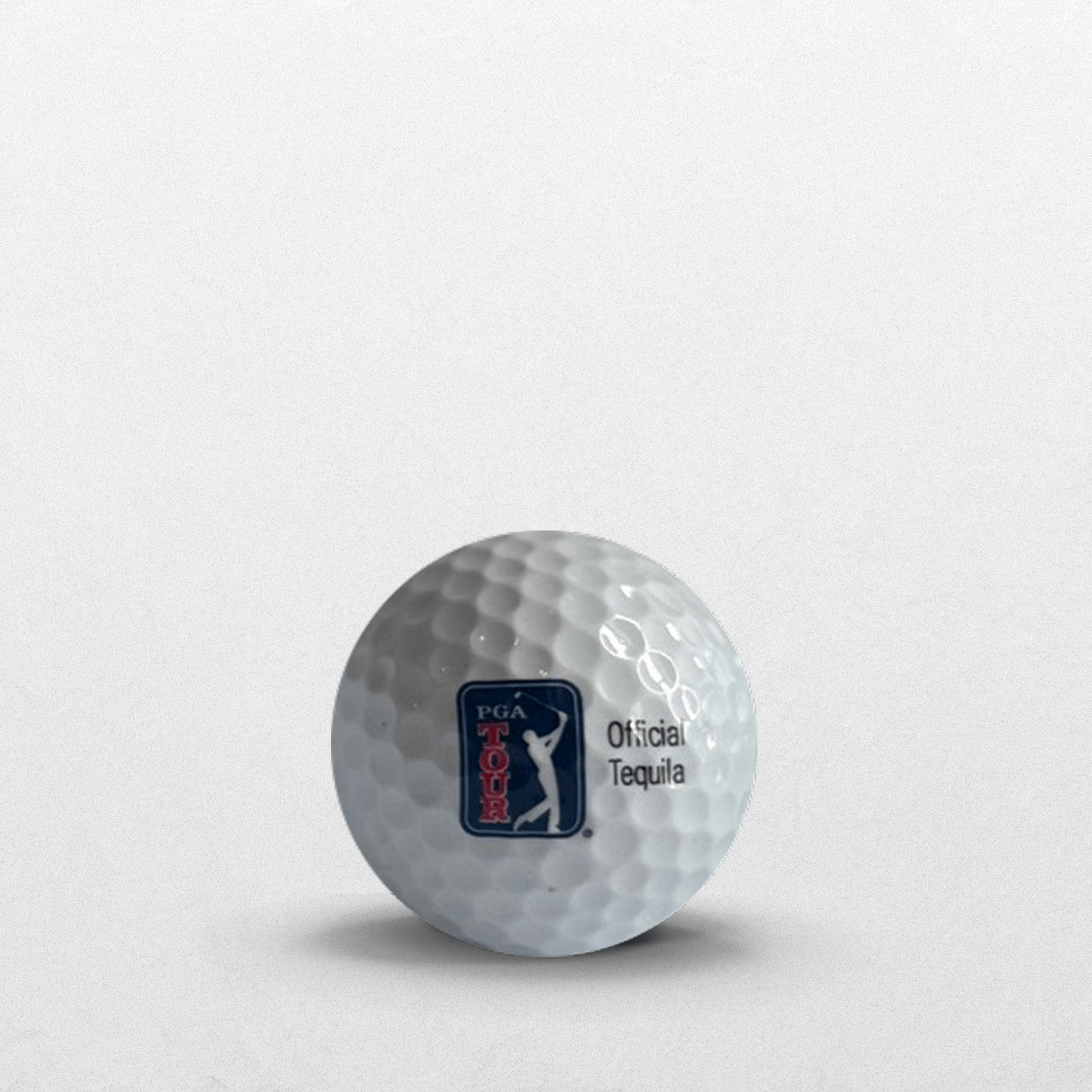 Back of white Dobel-branded golf ball with official tequila of the PGA Tour logo.