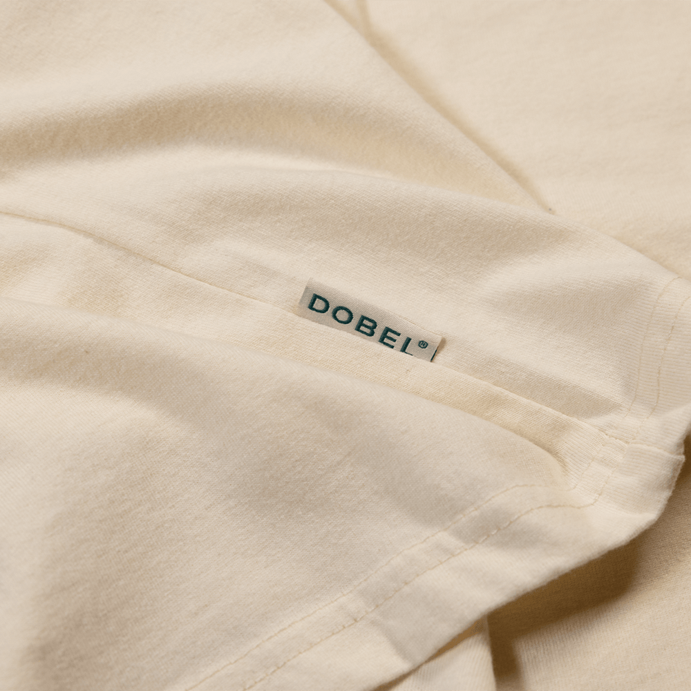 Close up detail of small Dobel tag logo.